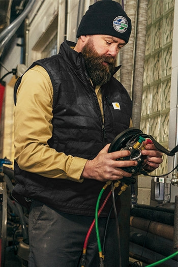 A shot of a man wearing Carhartt Gilliam Vest.