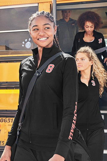 A shot of a woman wearing Women's Sport-Wick® Stretch Full-Zip Cadet Jacket.