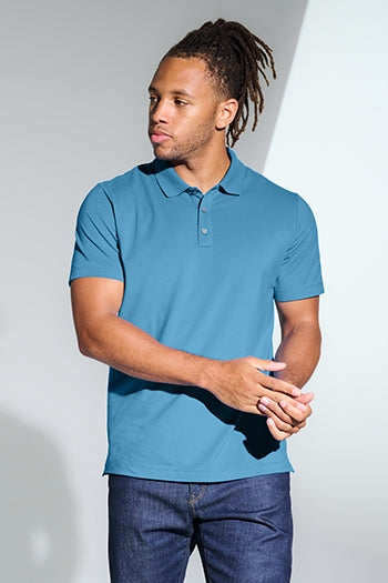 A shot of a man wearing Mercer+Mettle® Stretch Pique Polo.