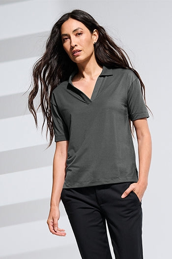 A shot of a woman wearing Mercer+Mettle® Women’s Stretch Jersey Polo.