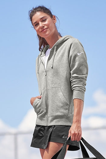 A shot of a woman wearing Nike Women's Club Fleece Sleeve Swoosh Full-Zip Hoodie.