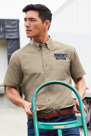 A photo of a man wearing Port Authority Short Sleeve Twill Shirt.
