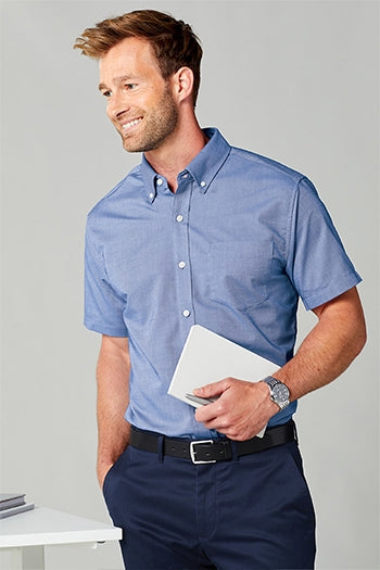 A shot of a man wearing Port Authority Short Sleeve SuperPro Oxford Shirt.