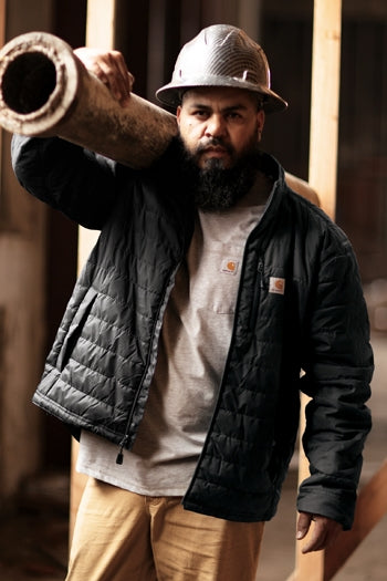 A shot of a man wearing Carhartt Gilliam Jacket.