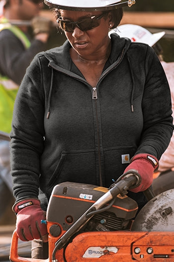 A shot of a woman wearing Carhartt Women’s Clarksburg Full-Zip Hoodie.