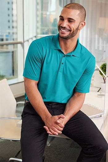 A shot of a man wearing Port Authority Eclipse Stretch Polo.