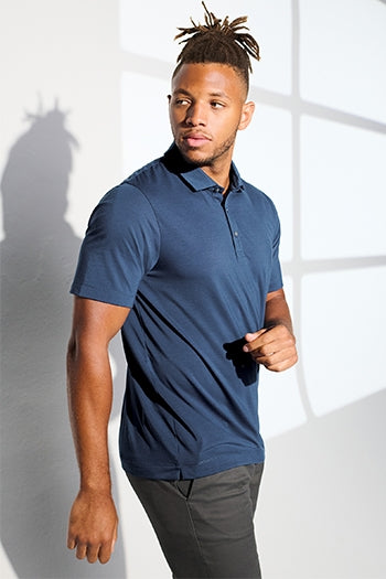 A shot of a man wearing Mercer+Mettle® Stretch Jersey Polo.