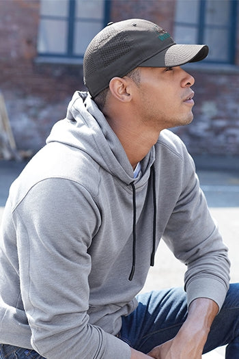 A shot of a man wearing New Era Perforated Performance Cap.