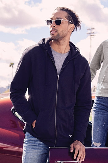 A shot of a man wearing New Era® Comeback Fleece Full-Zip Hoodie.