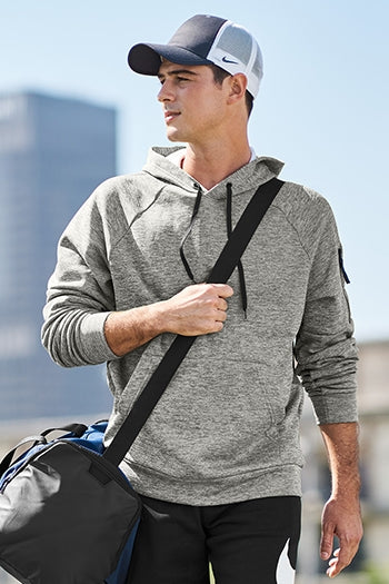A shot of a man wearing Nike Therma-FIT Pocket Pullover Fleece Hoodie.