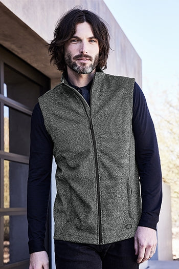 A shot of a man wearing OGIO® Grit Fleece Vest.