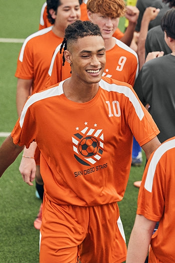 Men on a soccor team wearing Sport-Tek  Competitor™ United Crew.