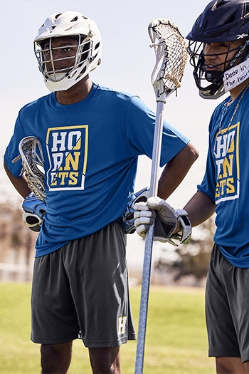 Men on a lacross team wearing Sport-Tek Competitor™ 7” Pocketed Short.