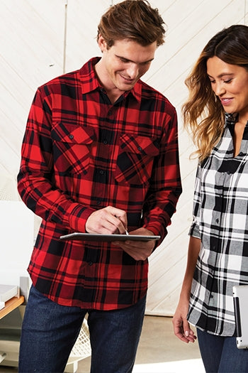 A shot of a man wearing Port Authority Plaid Flannel Shirt.