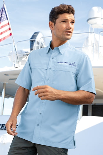 A shot of a man wearing Port Authority® Short Sleeve UV Daybreak Shirt.