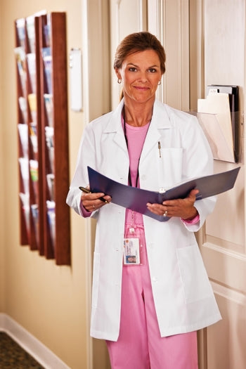 A shot of a woman wearing White Swan META Fundamentals 33" Ladies Lab Coat.